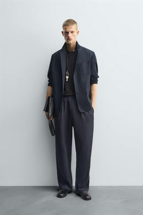 FLOWING PLEATED TROUSERS - Image 1