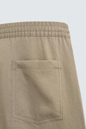 FLOWING PLEATED TROUSERS - Image 10