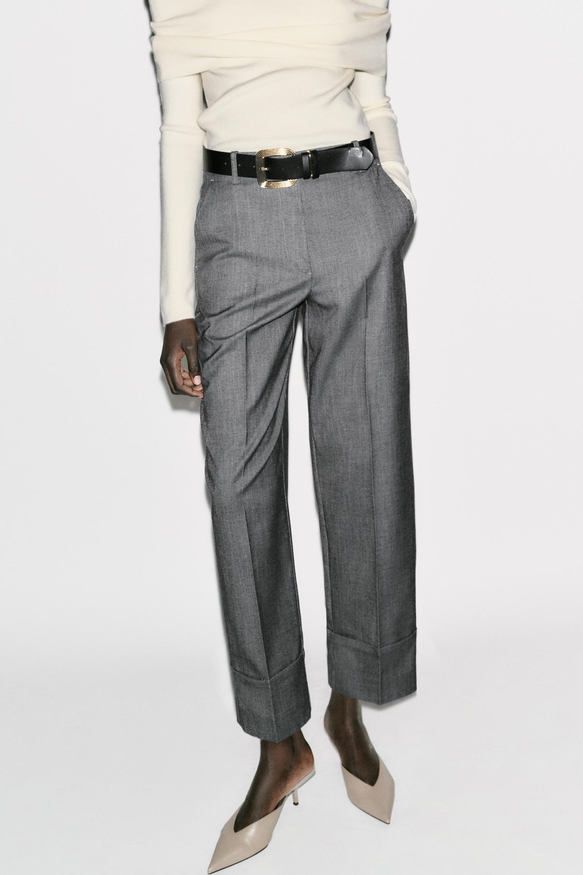 Trousers with turn-up hems.