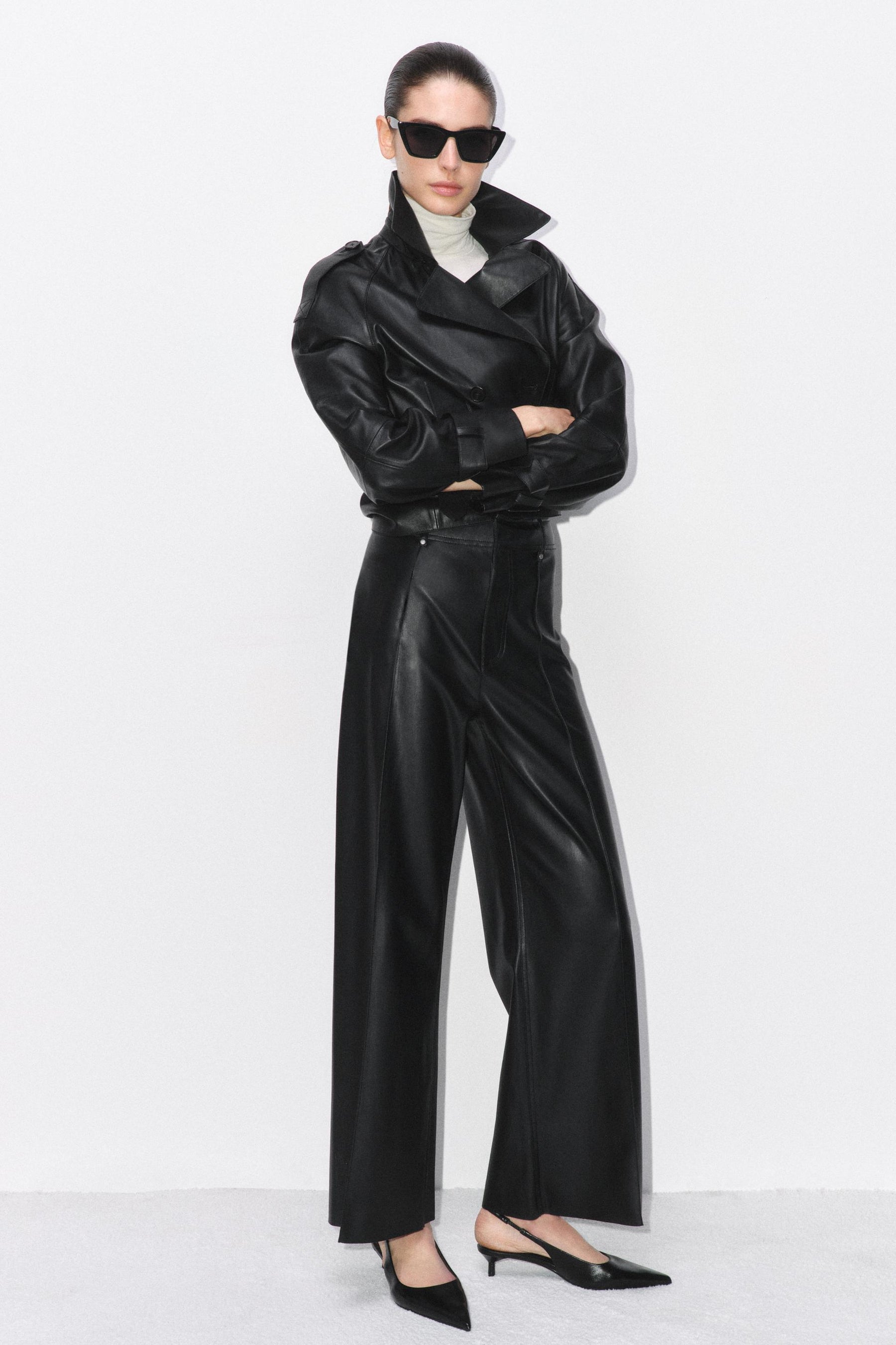 Tailored wide-leg leather-effect trousers.