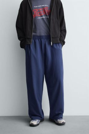TECHNICAL TROUSERS WITH TAPING - Image 2