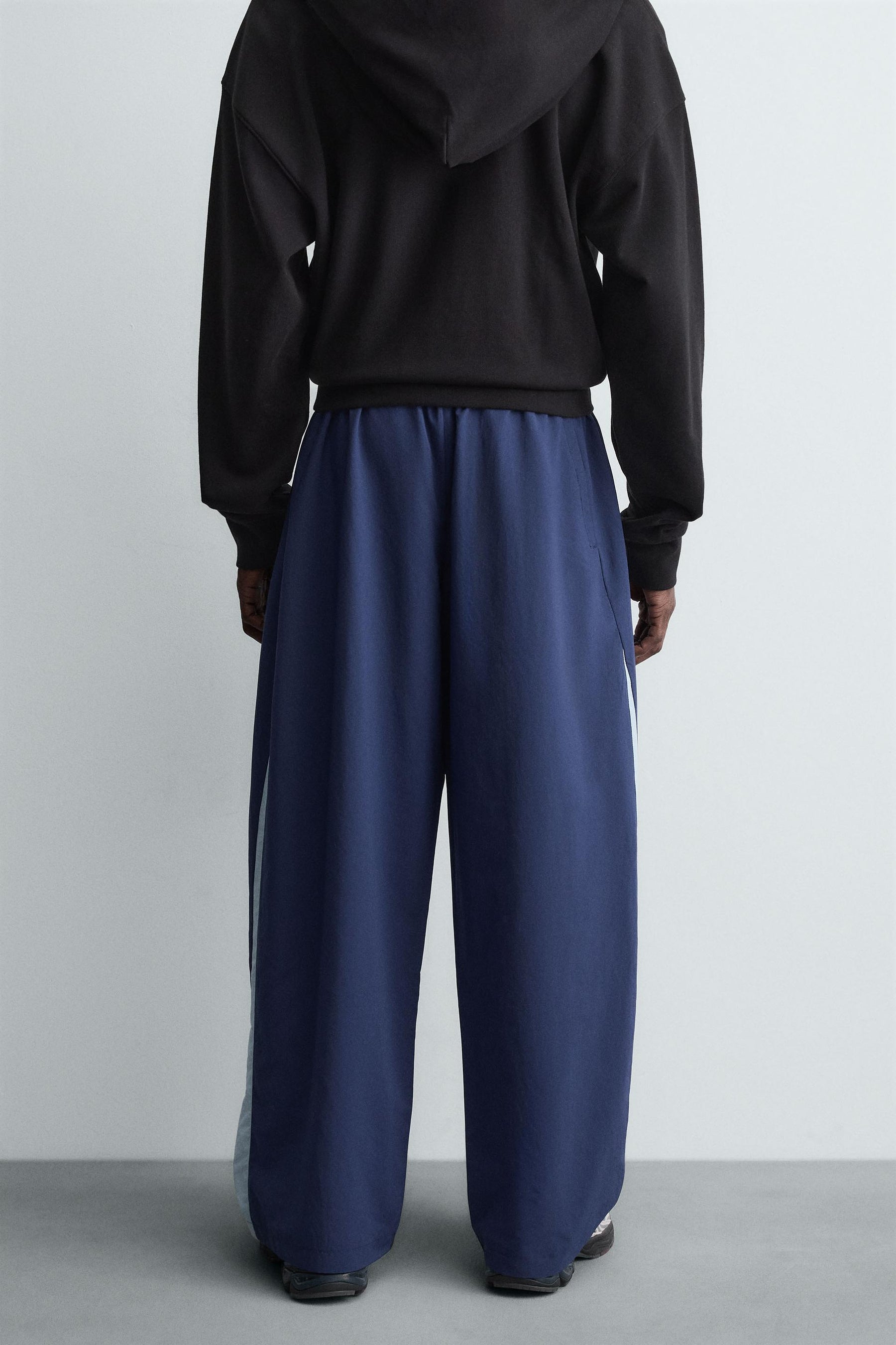 TECHNICAL TROUSERS WITH TAPING - Image 3
