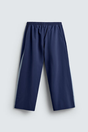 TECHNICAL TROUSERS WITH TAPING - Image 8