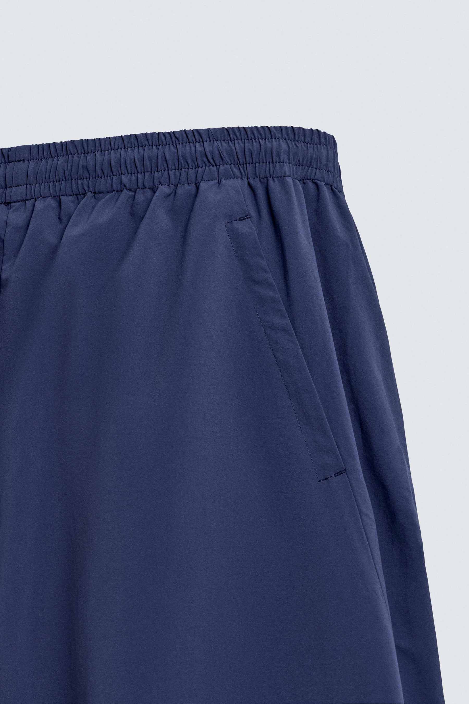 TECHNICAL TROUSERS WITH TAPING - Image 10