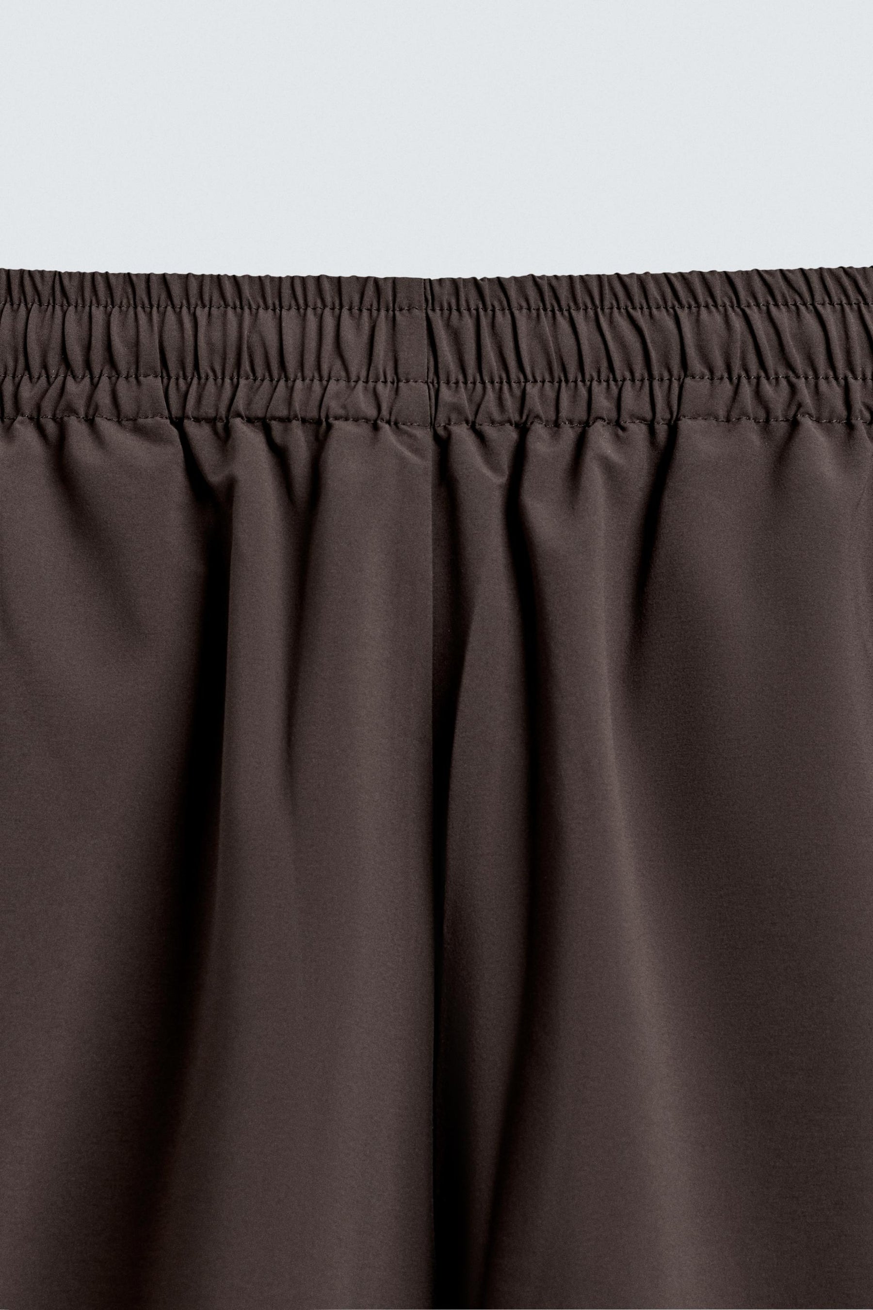 TECHNICAL TROUSERS WITH TAPING - Image 9