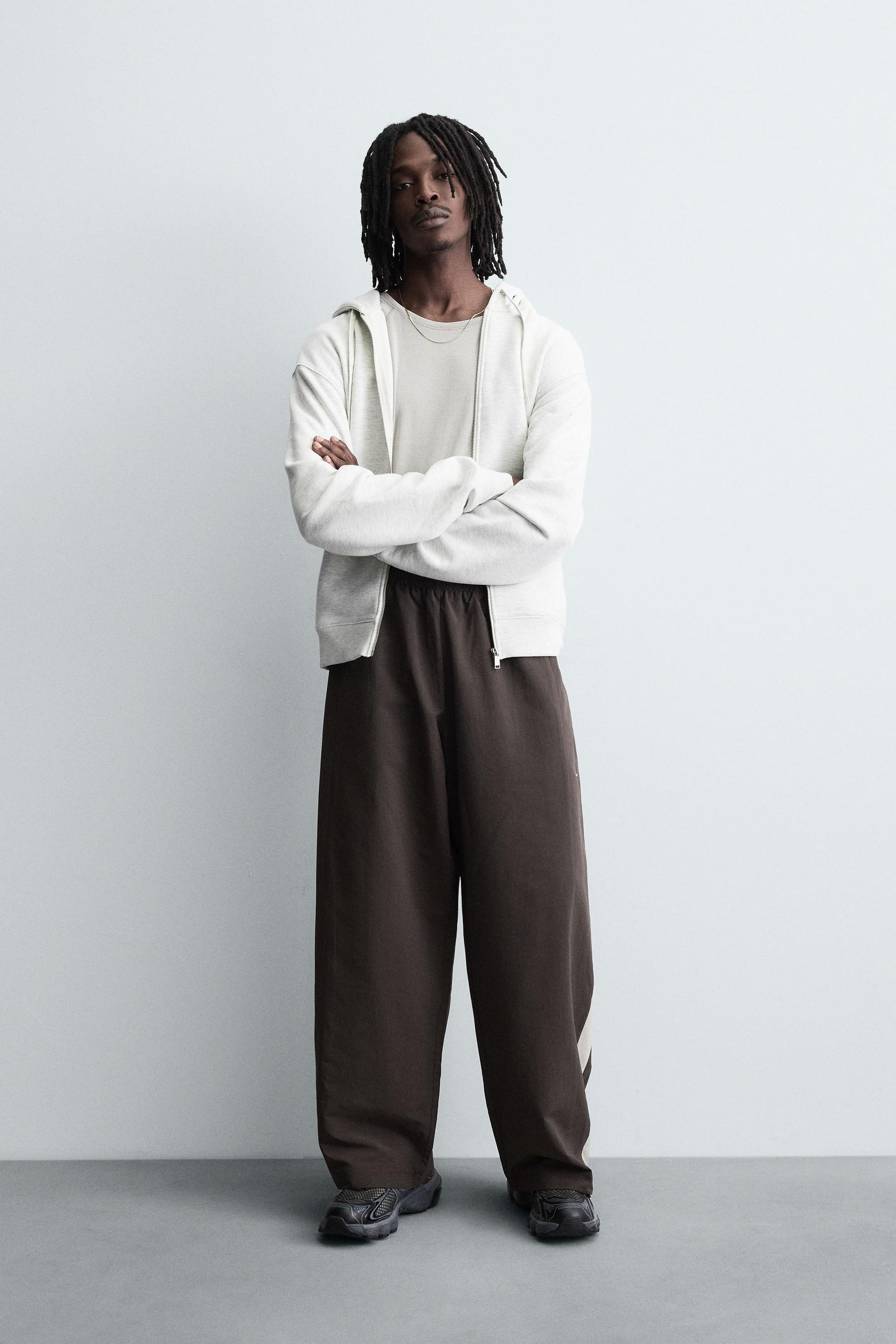TECHNICAL TROUSERS WITH TAPING - Image 1