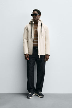 TECHNICAL HOODED JACKET - Image 1