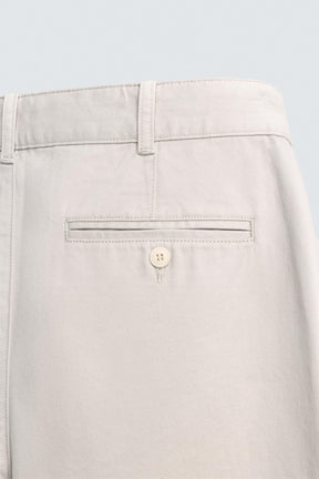 RELAXED FIT PLEATED TROUSERS - Image 9