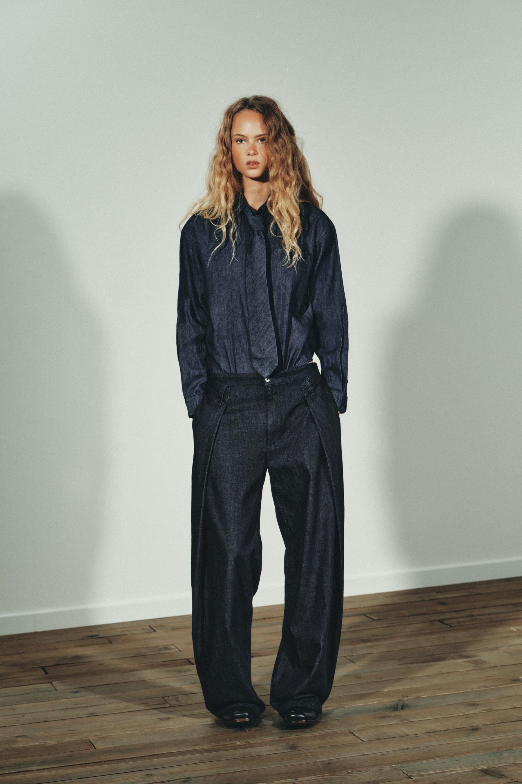 PLEATED DENIM TROUSERS