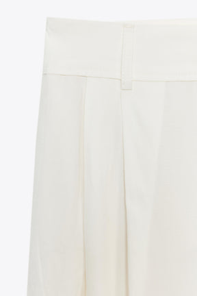 PLEATED TROUSERS WITH FLAPS