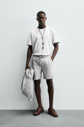 TEXTURED COMFORT BERMUDA SHORTS - Image 1