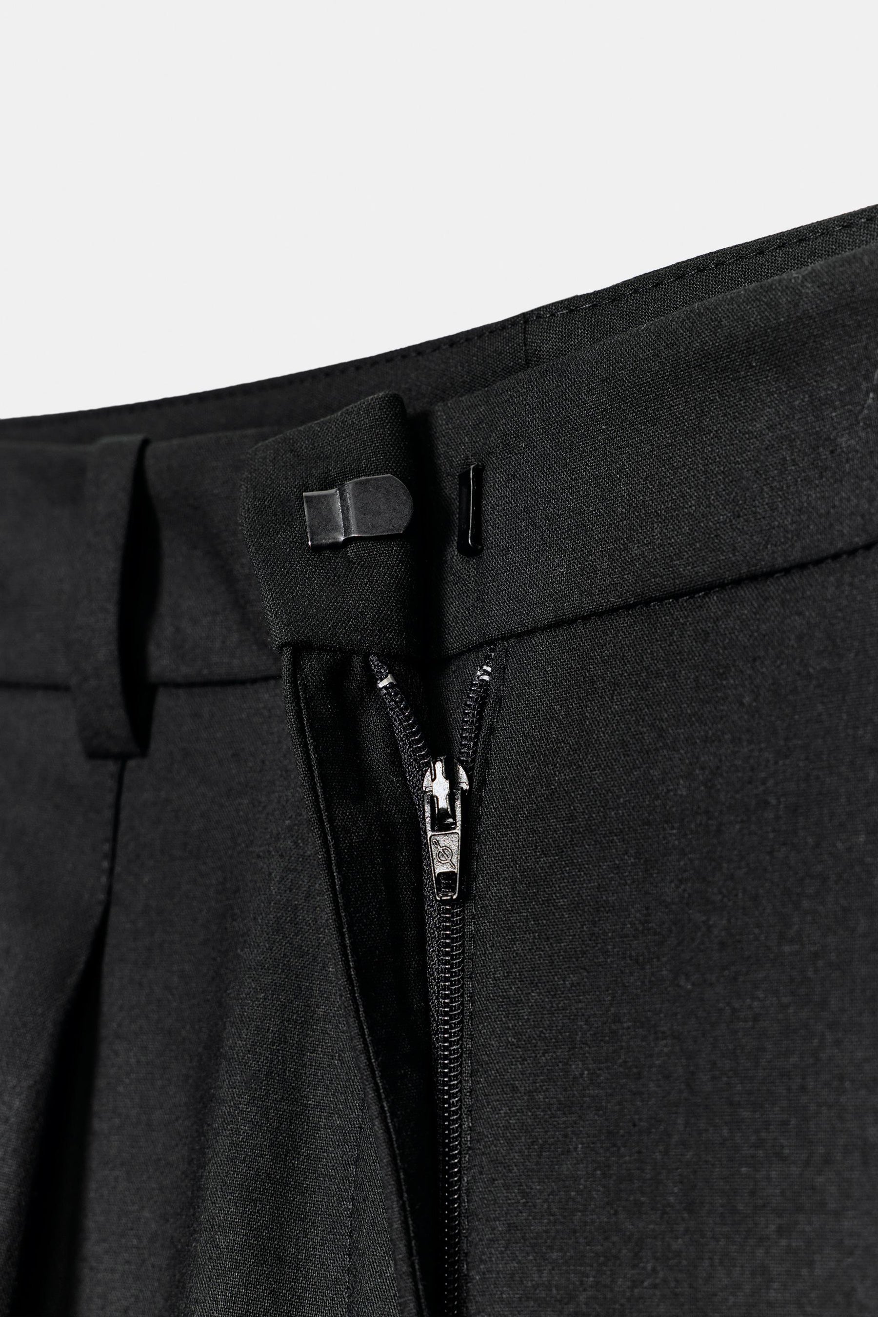 Straight-leg trousers with belt.