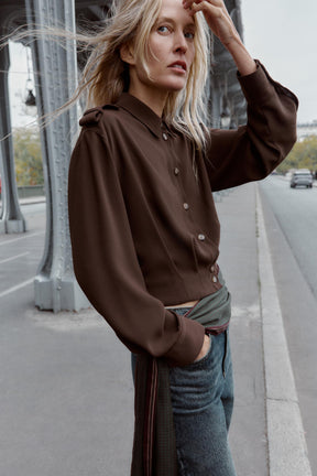 Shirt with shoulder tabs