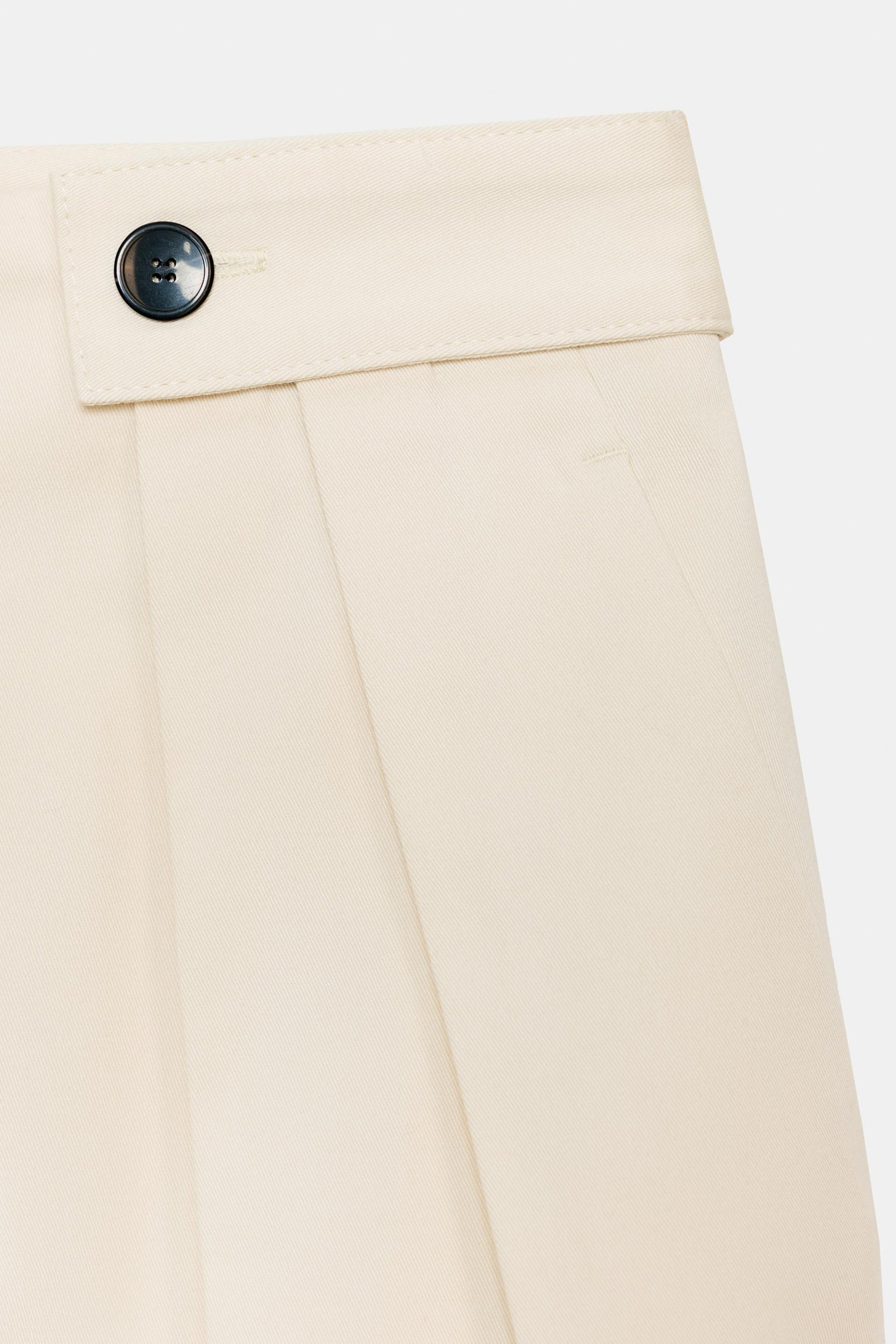 Trousers with button waist