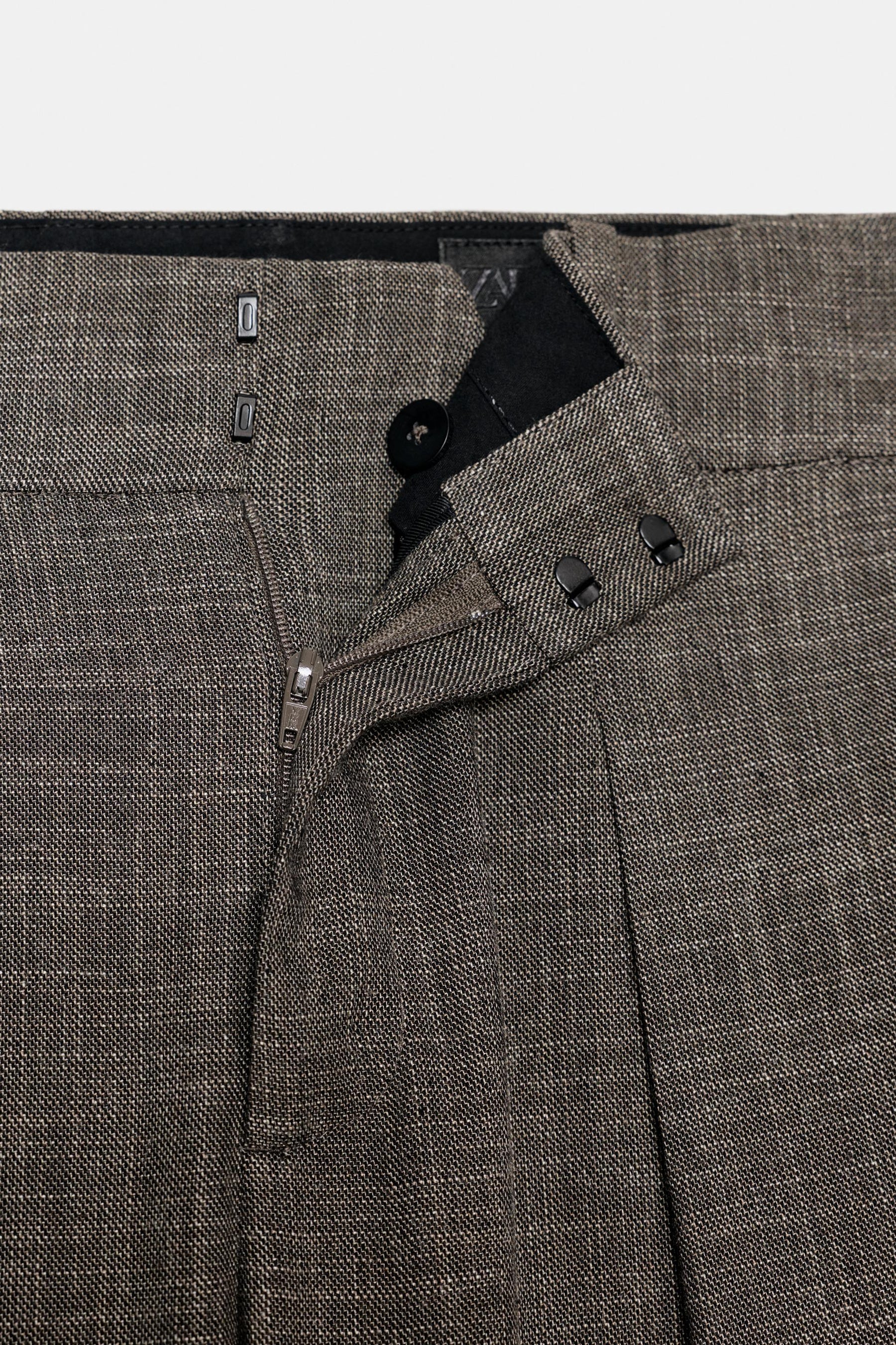 Trousers with button cuff