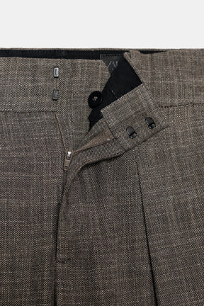 Trousers with button cuff