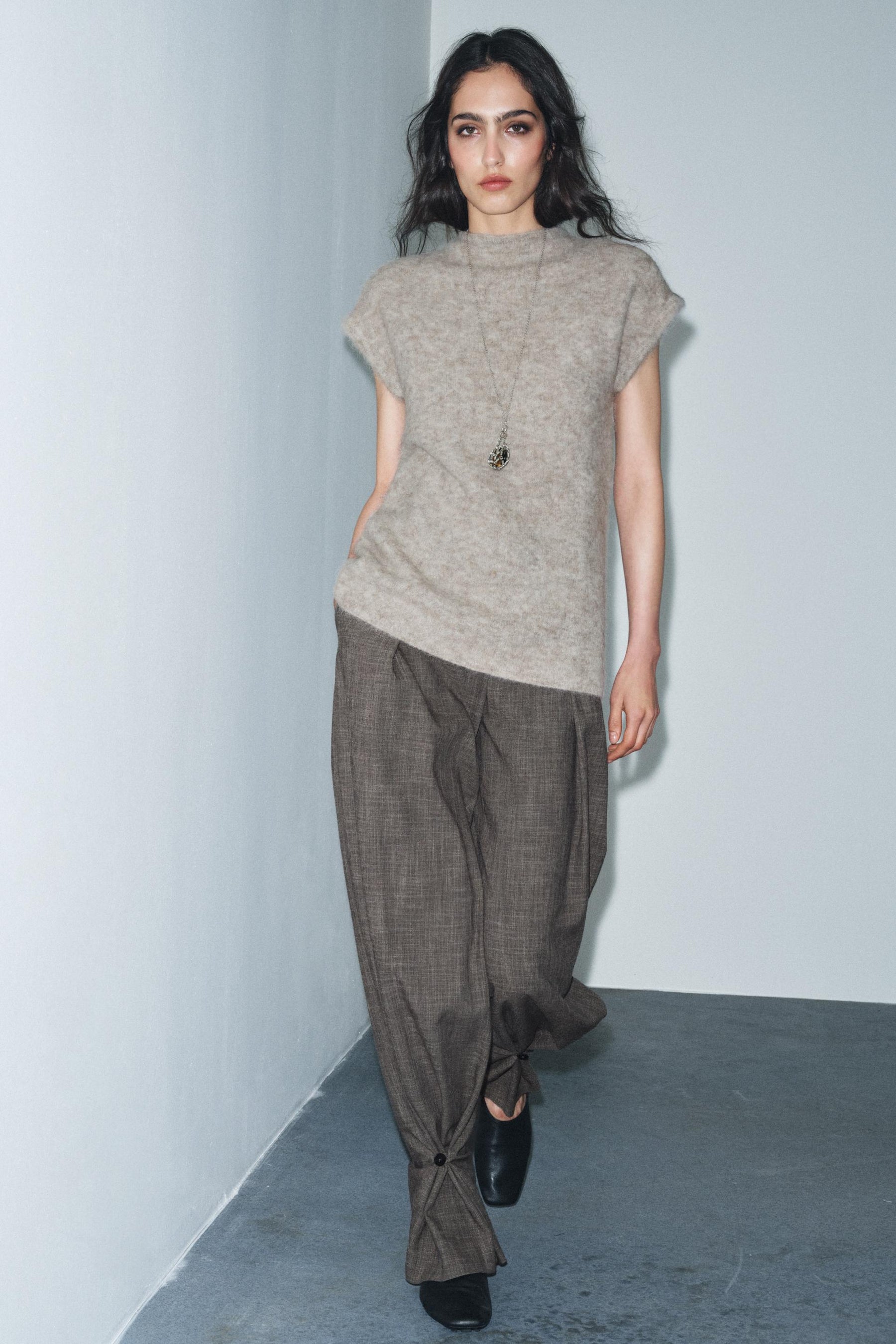 Trousers with button cuff